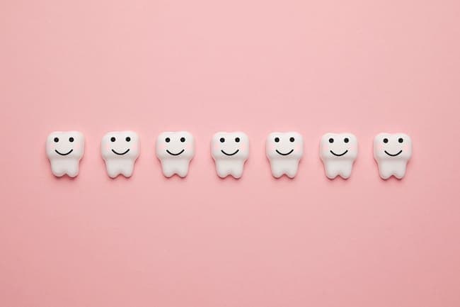 Teeth whitening, enamel. Cleanliness and hygiene of oral cavity for children. Cartoon anatomy on pink background